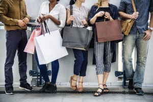 Diverse people with shopping bags