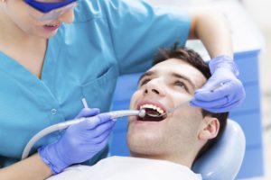 Man having teeth examined at dentists